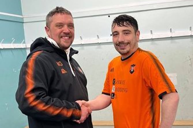 Wellington A man of the match against Bridgwater Grasshoppers was Tom Scarlett who is pictured being congratulated by joint manager Matt Groves.