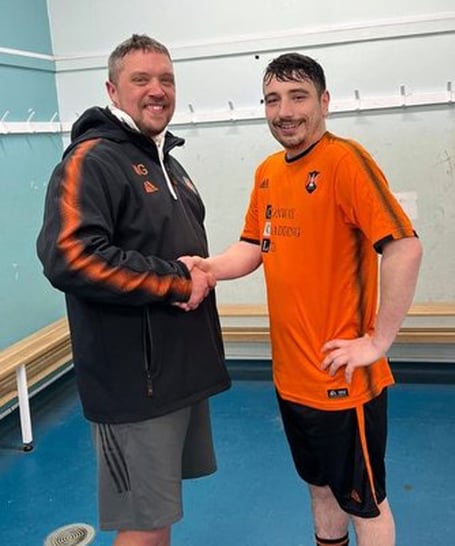 Wellington A man of the match against Bridgwater Grasshoppers was Tom Scarlett who is pictured being congratulated by joint manager Matt Groves.