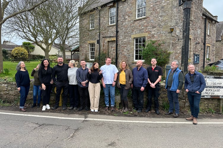 Jon and Millie Coward, fourth and fifth from left.