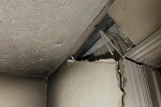 A hole in a wall of the property reportedly caused by an exploding aerosol can 