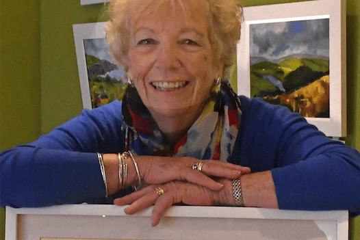Sue Walsh with her mixed media picture of Watchet Harbour. 