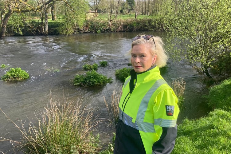 Liberal Democrat Parliamentary candidate Rachel Gilmour beside the River Exe.