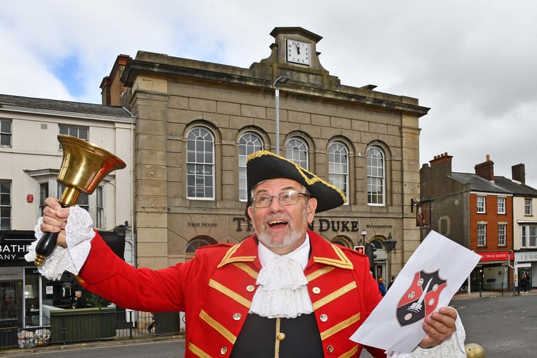 Wellington's town crier Andrew Norris give a Royal proclamation for the first anniversary of the coronation of King Charles III.