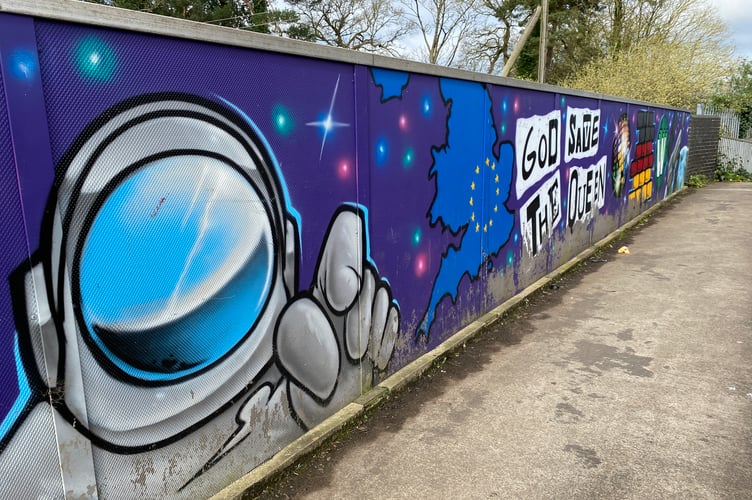 A colourful mural on Tonedale bridge