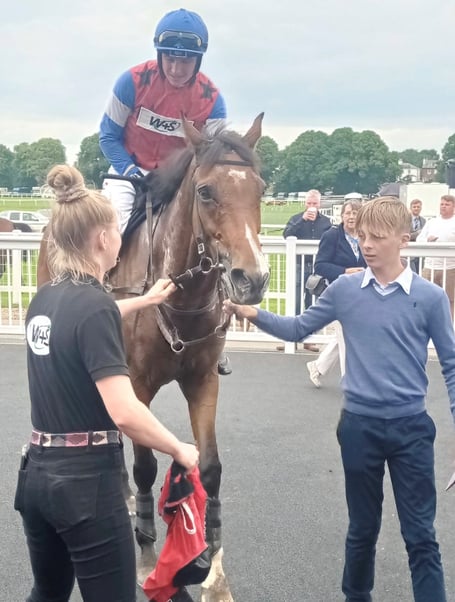 Mr Tambourine Man being led back to the winners enclosure at Worcester with Neve Daniel, jockey Jack Tudor and Jack Pipe