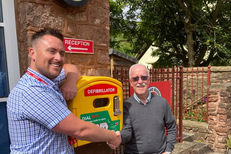 Jonathan Moise-Souch, Head of School (left), and Derek Sowden, Parish Council Chair, right