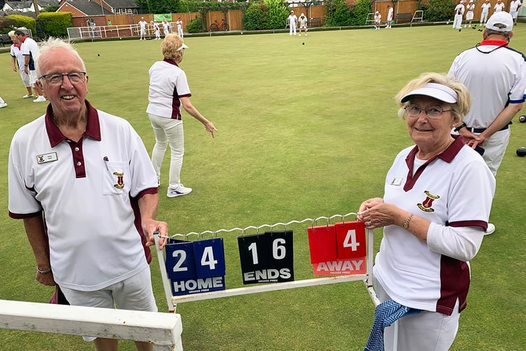 Arthur and Ann showing their team's big score