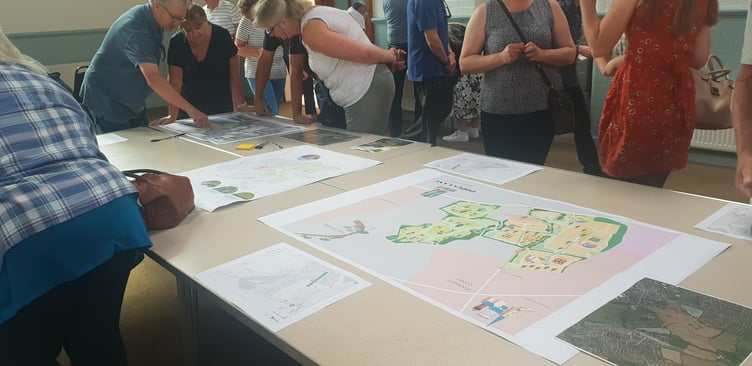 Maps and drawings were on show at a Persimmon Homes public consultation on proposed new housing in Popes Lane, Rockwell Green.