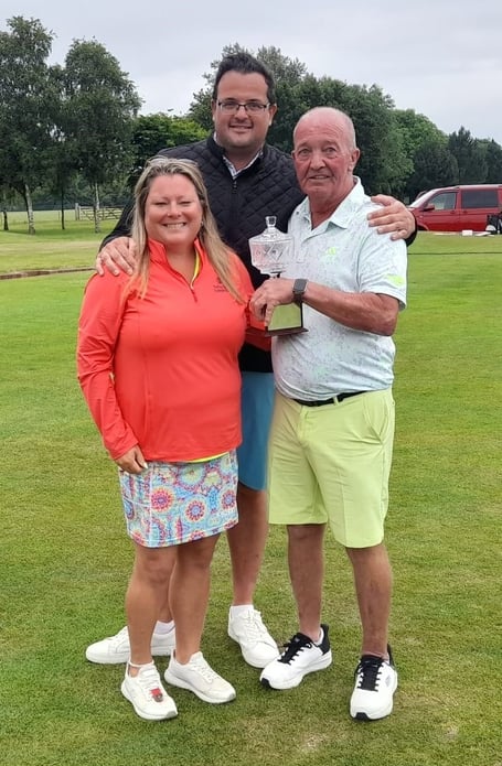 John Ball, centre, representing Terence Ball Kitchens, presents the Terence Ball Memorial Trophy to winners Shane Bordier and John Byrne.