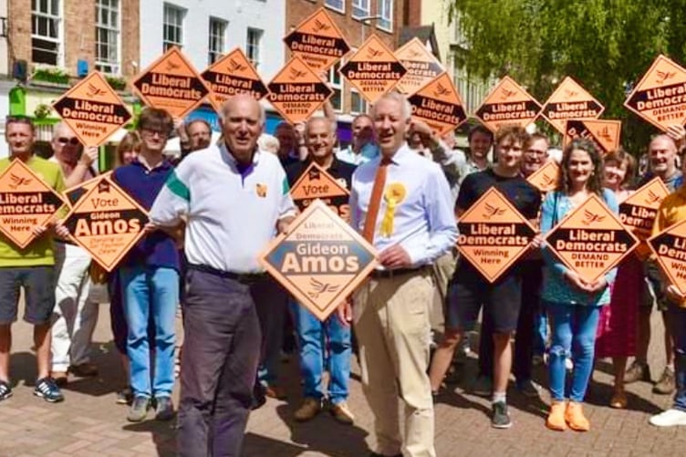 Former Liberal Democrats leader Sir Vince Cable (left) with Parliamentary candidate Gideon Amos and supporters.