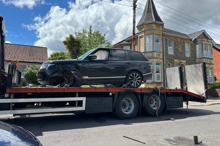 The damaged Range Rover is removed after Sunday's smash in Wellesley Park, Wellington.