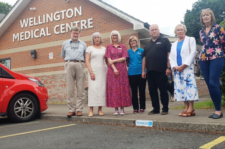 Pictured in the car park of Wellington Medical Centre are (left to right) PPG vice-chairman John Cutting, chairman Veronica Tatnall, practice manager Lydia Daniel-Baker, Polly and Richard Frayling, of Signs Express, PPG treasurer Ann Cowling, and fund-raiser Janet Govier.