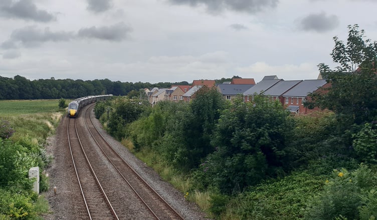 A train passes close to where Wellington Railway Station is planned to be built.