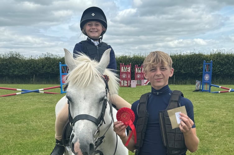 Martha Pipe on Tandy led by older brother Jack