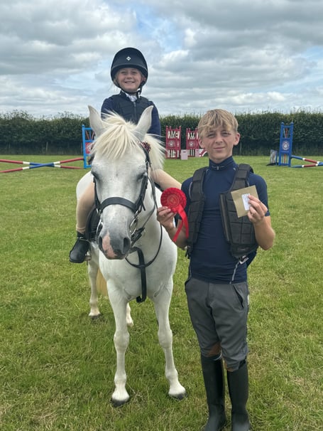 Martha Pipe on Tandy led by older brother Jack