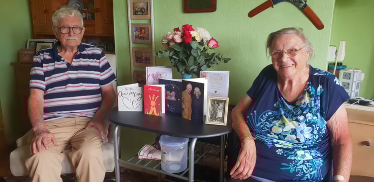 William and Rosemary Franks, known as Bill and June, with cards received for their 70th wedding anniversary, including from the King and Queen.