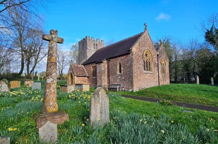 St John the Baptist Church and its churchyard in Tolland. 