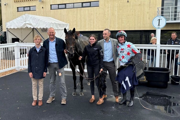 Oceanline in the winners enclosure at Worcester: Jack Pipe (left), Amy Clark (centre), leading horse Jack Tudor (right) and winning connections.