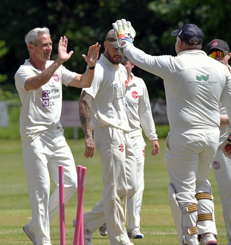 Andy Hurry celebrates taking a wicket for Wellington 2nd XI earlier this season