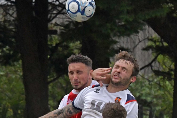 Jamie Price (red shirt) and Sam Towler in aerial action.