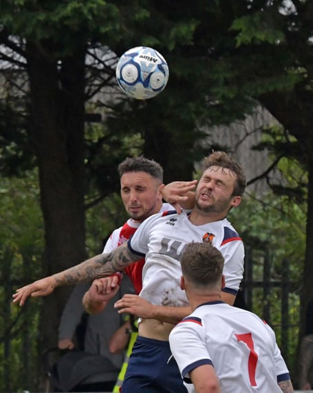 Jamie Price (red shirt) and Sam Towler in aerial action.