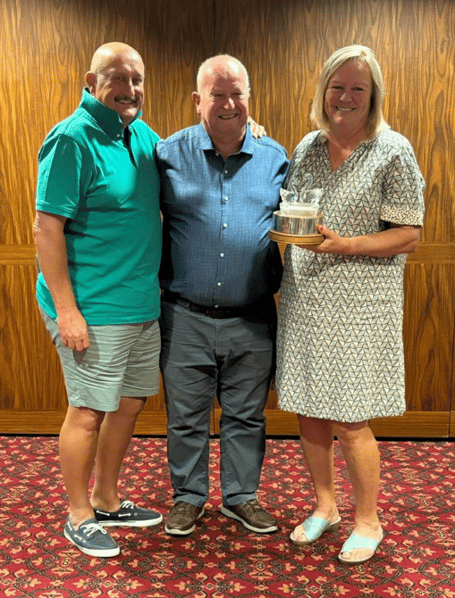 Cob and Pen Mixed Greensomes winners Paul and Gill Hadley Trophy, with centre Peter Swann presenting trophy he donated to the club in 2005