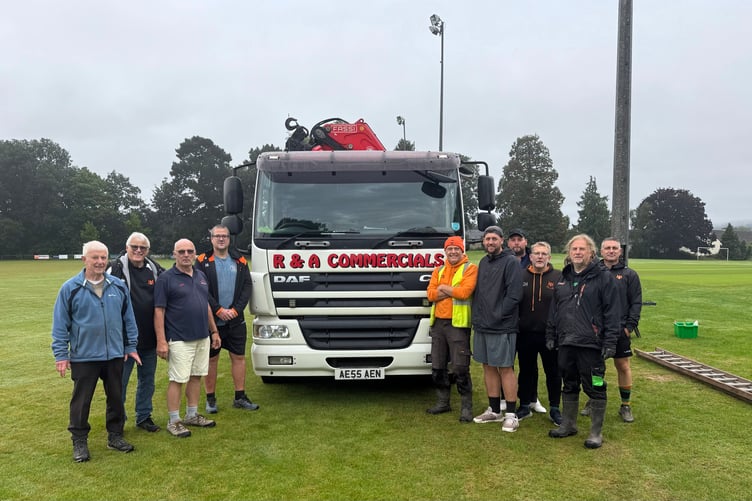 With the cricket season having ended at the Playing Field, club volunteers put the four pylons on the wicket side of the football pitch back up on Saturday morning.