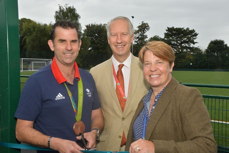 A 3G sports pitch for Court Fields School, Wellington, is opened by (left to right) former pupil and Olympic bonze medallist Ed Ling, Wellington MP Gideon Amos, and headteacher Polly Matthews.