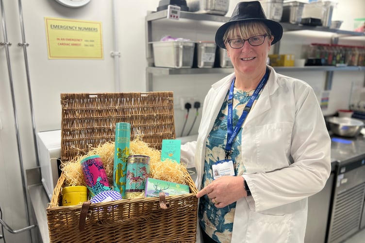 Pictured with the hamper she won: Amanda Vickery – catering operations manager at Somerset NHS Foundation Trust.