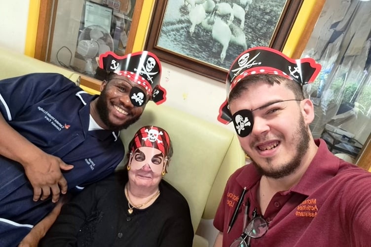 L-R Sammuel Abosah, registered nurse; resident Patricia Hill; Michael Rowe, activities assistant (Photo: Camelot House and Lodge)