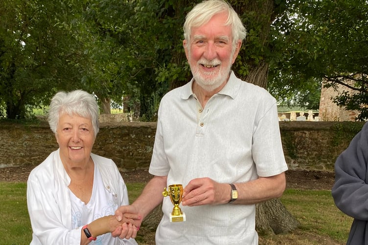 Steve Craig is presented with his trophy by Anne Woodford