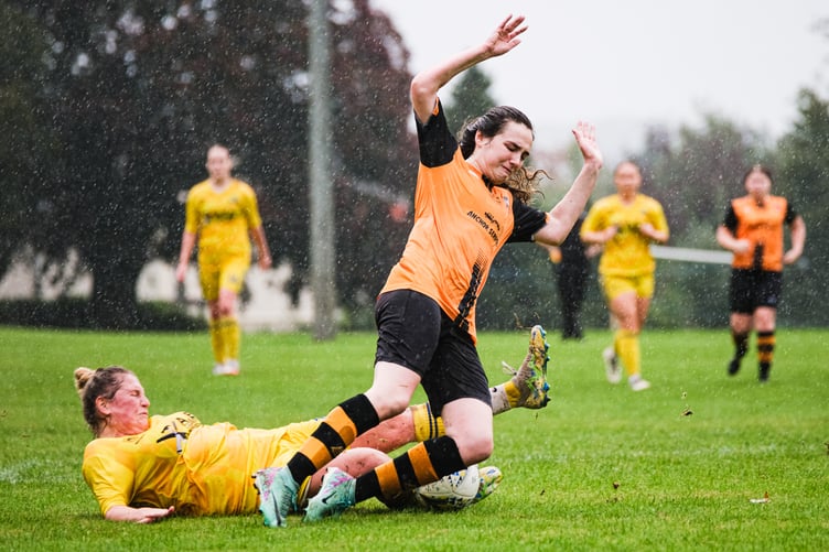 Wildcats' striker Leah Morrell is brought down for a penalty