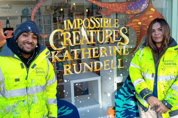 We the Seeds artists Rikesh and Marta hand painted the new design on the bookshop's window