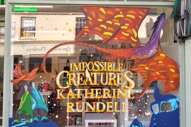 Bookshop by the Blackdowns has won a Bloomsbury sponsored prize-draw to have their shop window hand painted by the creative arts agency, We the Seeds.