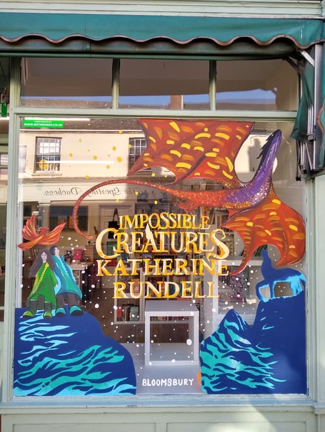 Bookshop by the Blackdowns has won a Bloomsbury sponsored prize-draw to have their shop window hand painted by the creative arts agency, We the Seeds.
