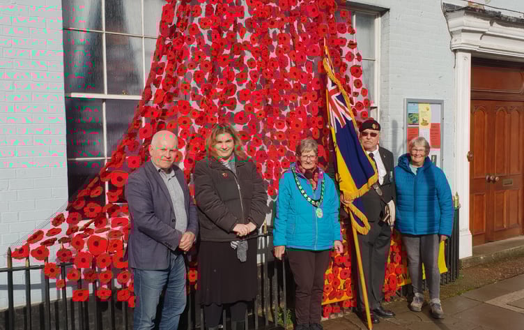Wellington Mayor Cllr Janet Lloyd (centre) attends the unveiling of the town's poppies displays by Women's Institute members with (left to right) town Cllrs John Thorne and Catherine Govier, Royal British Legion standard bearer, Bob Trickey, and display organiser Bridget Hodges.