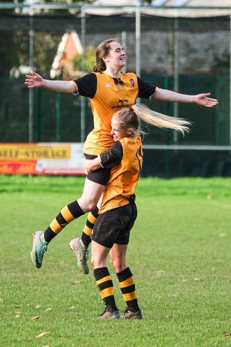 Leah Morrell celebrates Wildcats' opening goal with Ebony Sellick