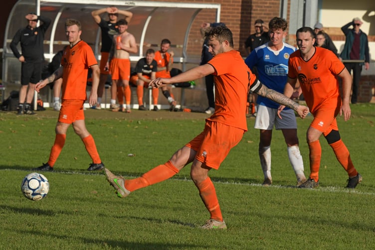 Sam Towler scores from the penalty spot in Wellington's 1-0 win over Oldland Abbotonians last Saturday.