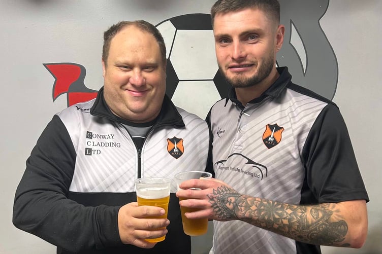 Wellington Reserves' Man of the Match Aaron Hawkings with the team's kit man Adrian Ridgeway.