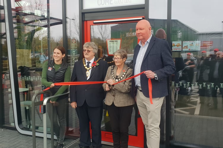 Wellington Mayor Cllr Janet Lloyd cuts a ribbon to open the new KFC restaurant in Chelston.