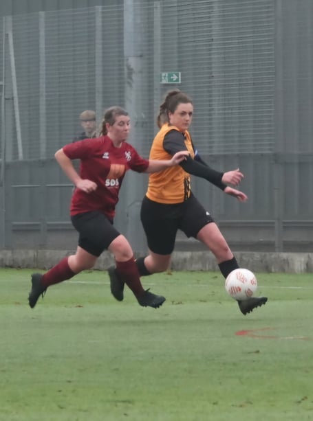 Grace Winter (right) in action for Wellington Wildcats