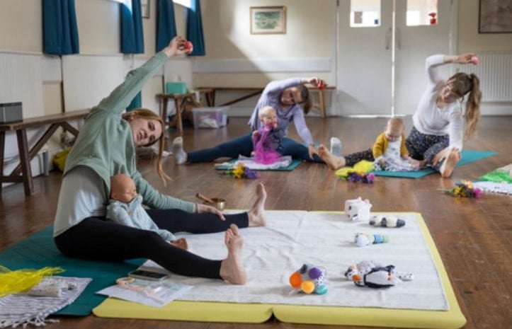 Rosina Hasell teaching a post-natal yoga class to local mothers