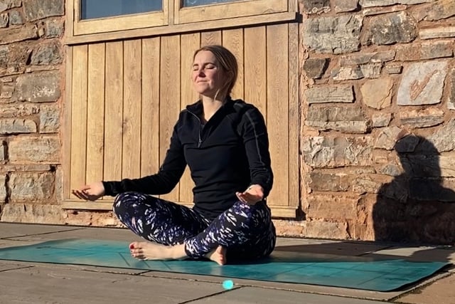 Yoga teacher working to support mums through pregnancy and post-birth