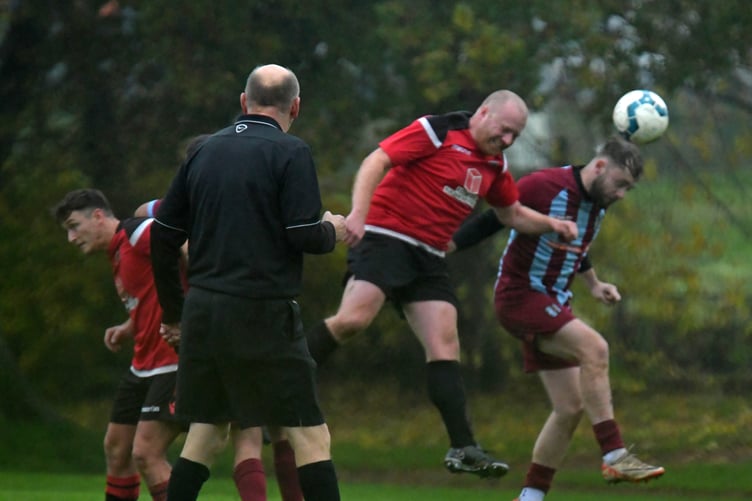 Clay Westcott heads clear for the Reds