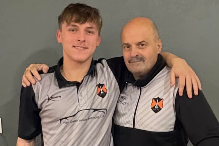 Wellington Reserves' Man of the Match Dylan Groves is congratulated by Michael Owen