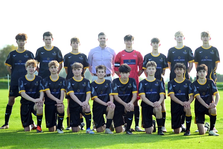 Justin Clark with the Queen's football team