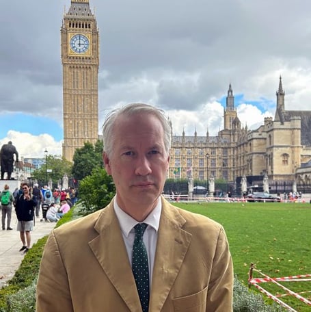 Gideon Amos pictured standing outside Parliament