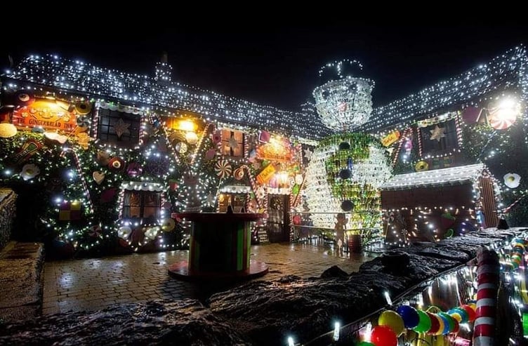 The Queen Victoria Pub in Priddy, adorned with its stunning festive lights display, ready to welcome visitors this Christmas season.