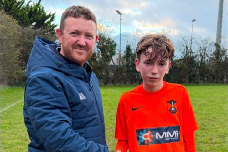 Wellington Town U14 coach Darren Winter with Player of the Match Sam Alderman
