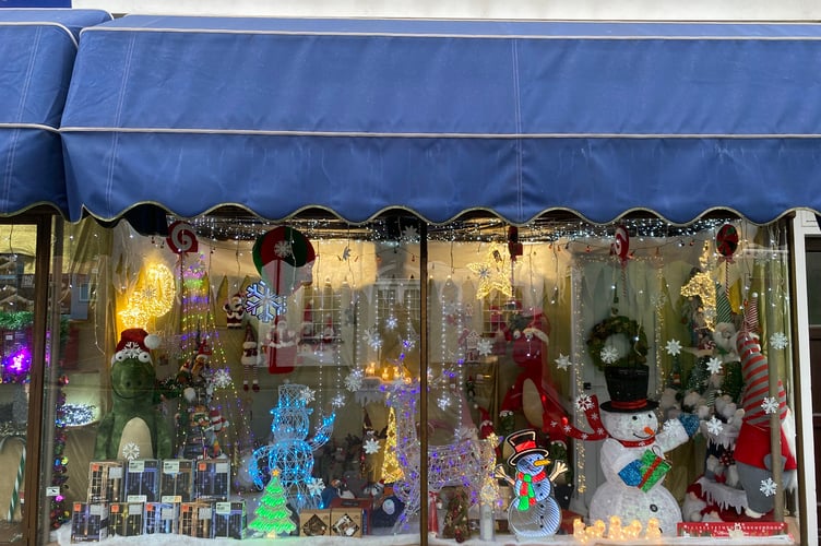 The window at HT Perry, Son & Granddaughter